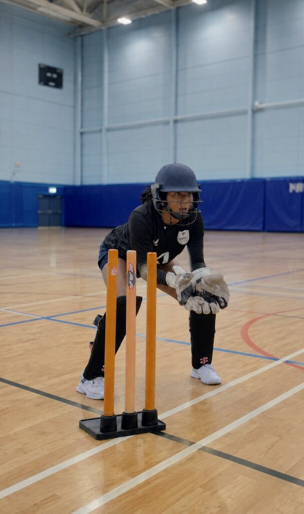 Close-up of a cricket ball meeting the bat during a shot.